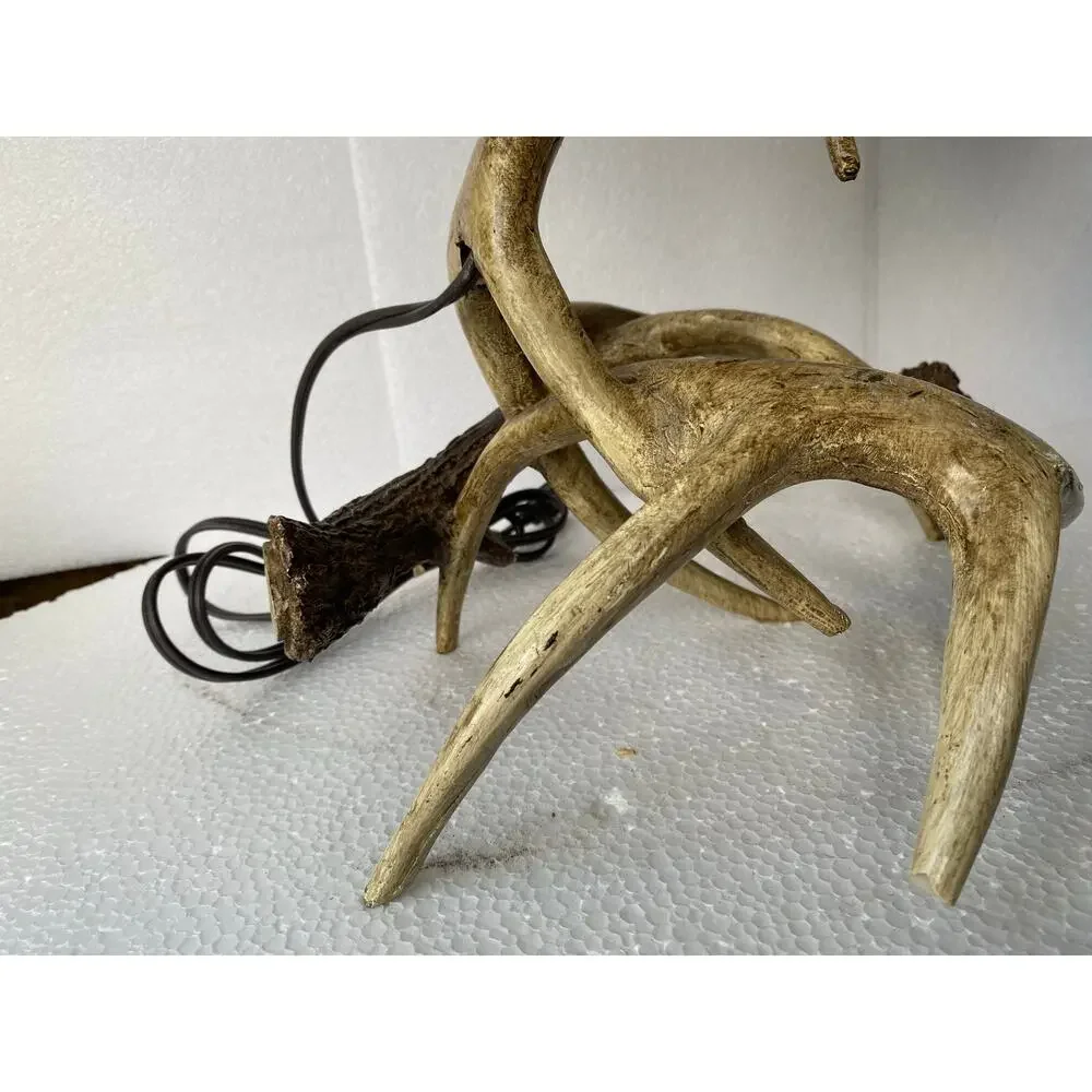 rustic table lamp featuring a base made of camo-patterned fabric lampshade